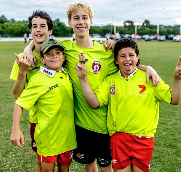 4 junior umpire volunteers posing for a photo