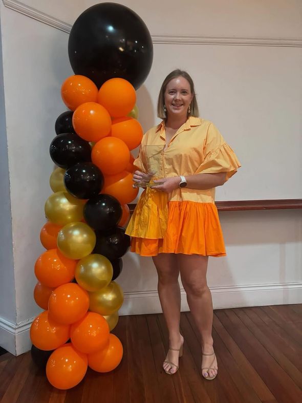 Club volunteer dressed to impress at a Yeppoon Swans formal club function