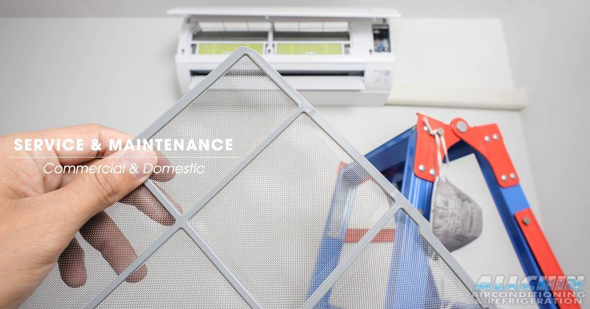 Hand Holding Air Conditioner Filter in Front of The Unit — Allchin Airconditioning & Refrigeration Electrical in Caloundra, QLD