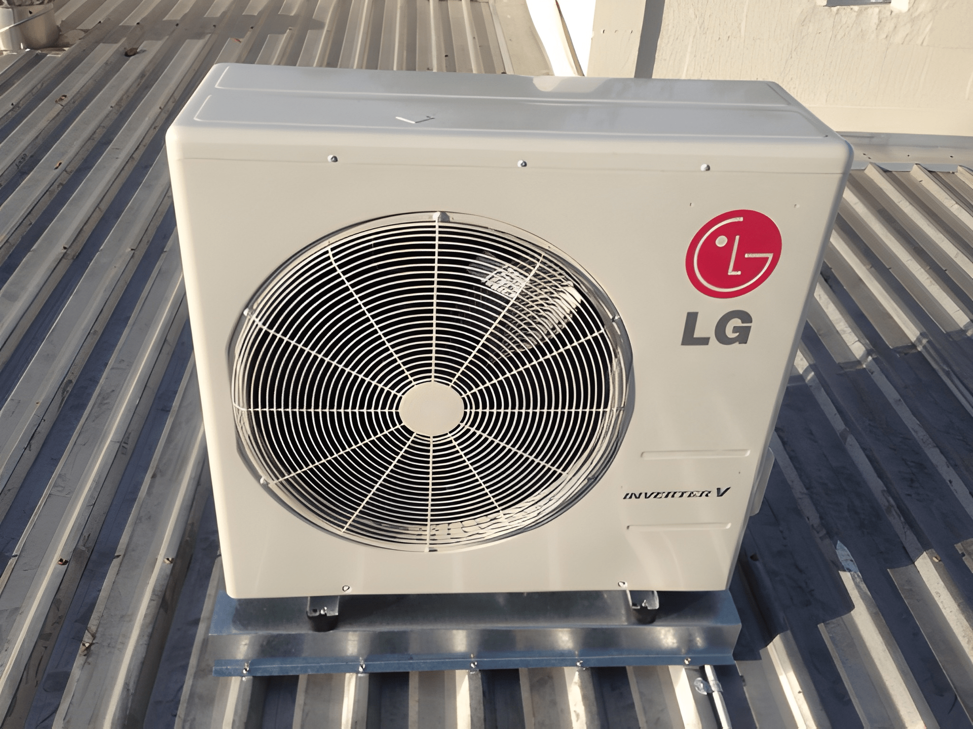 A Lg Air Conditioning Unit on A Corrugated Metal Roof — Allchin Airconditioning & Refrigeration Electrical in Caloundra, QLD