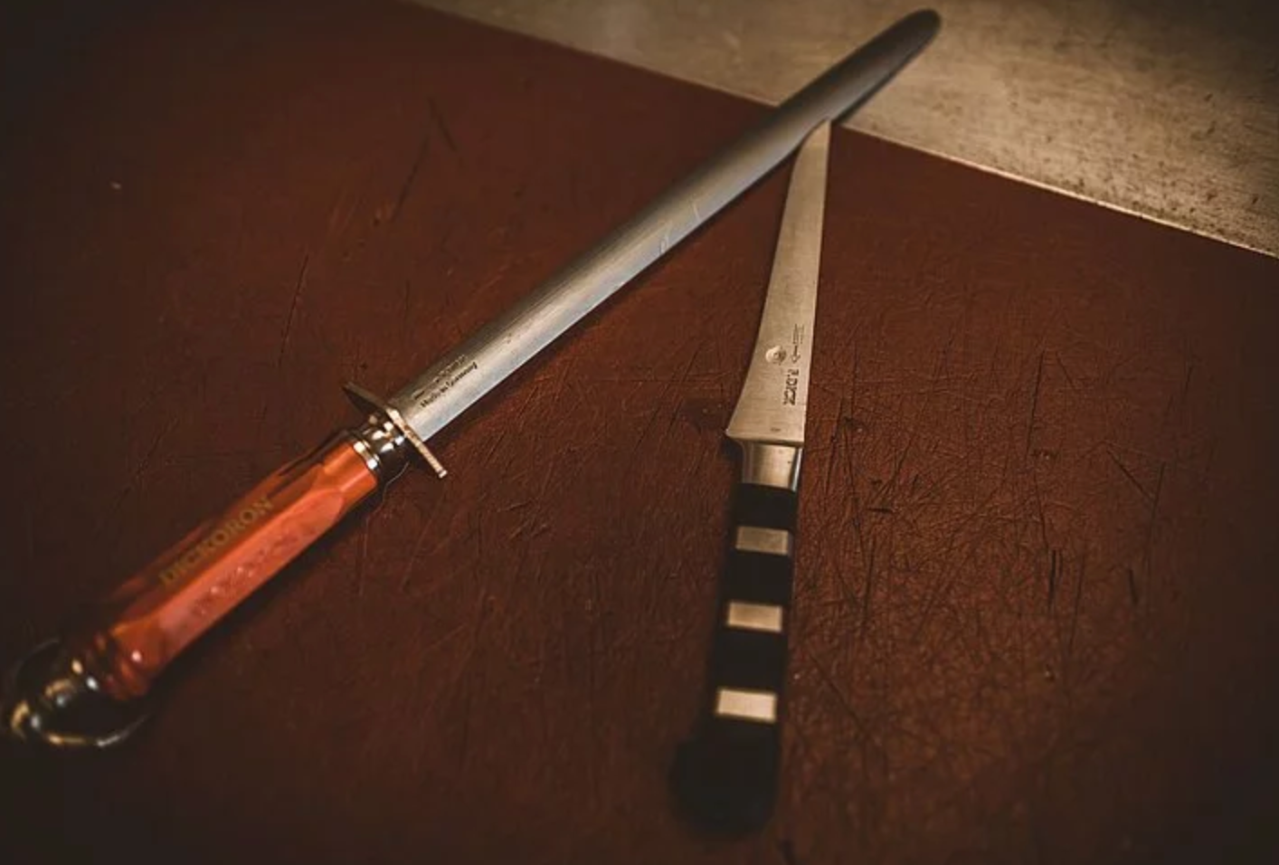 Midsection of Female Butcher Sharpening Knife to Cut — Local Butcher Wholesaler in Ballarat, VIC