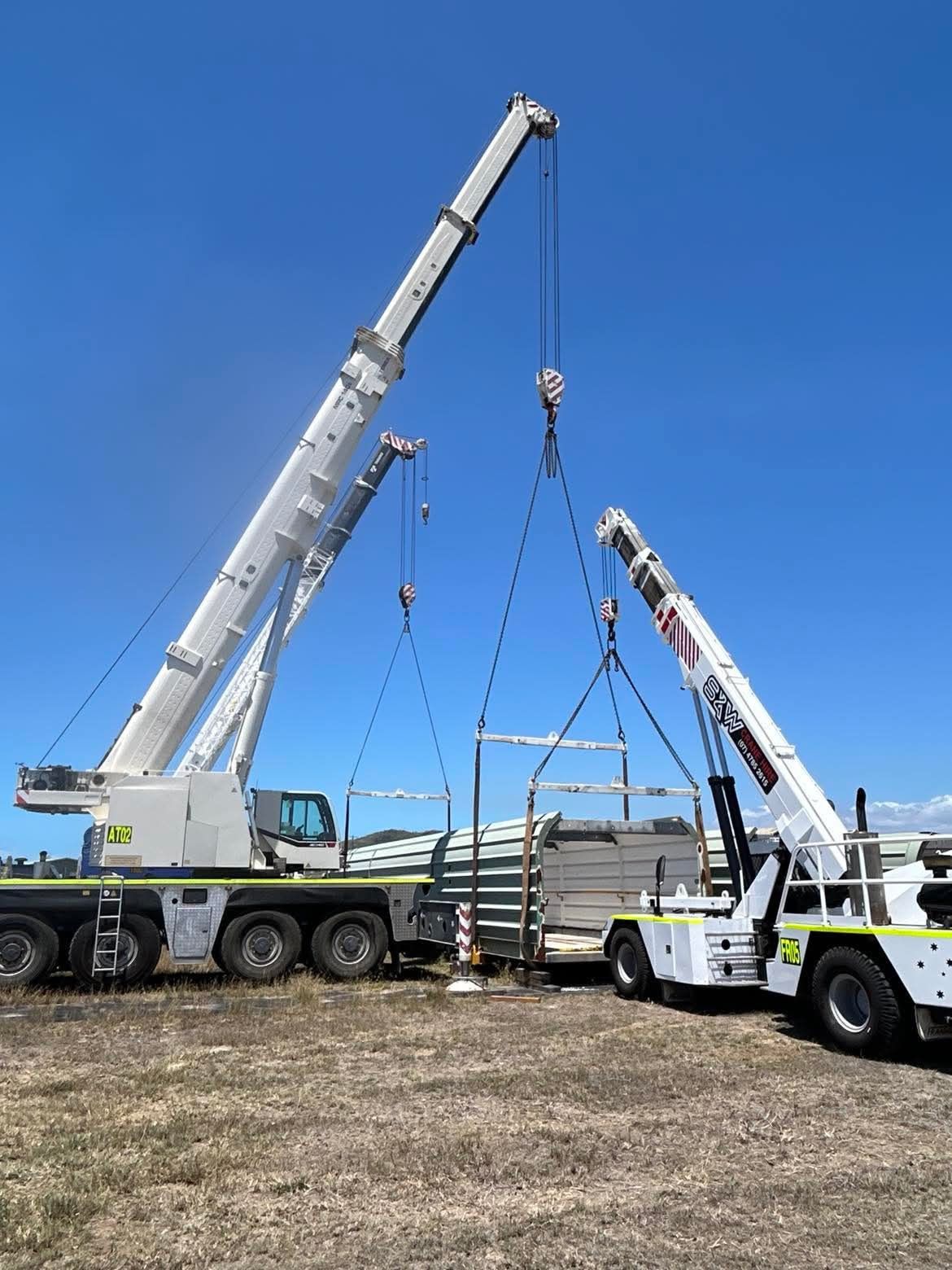 An Aerial View Of A Beach With A City In The Background — S & W Crane Hire In Collinsville, QLD