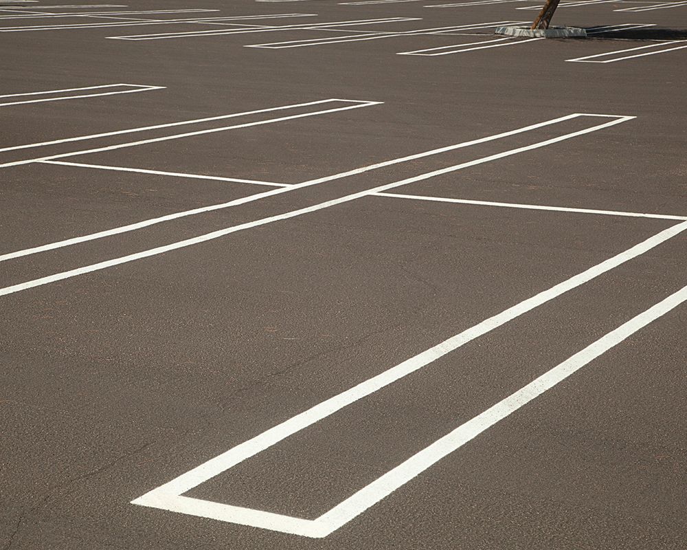 Newly painted striping in a parking lot with no cars | Warehouse Equipment Solutions | Desoto, TX Newly painted striping in a parking lot with no cars | Warehouse Equipment Solutions | Desoto, TX