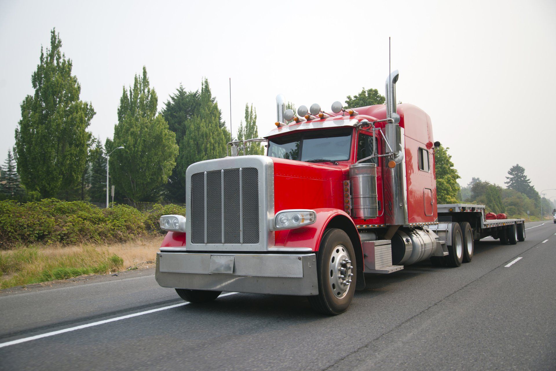 Red Trailer Truck On Road — Columbus, OH — Frame And Spring Inc