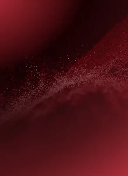 A close up of a red background with a swirl of dust coming out of it.