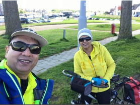 Cycling warm-up for couples couples coaching in Europe, two riders smiling before the ride