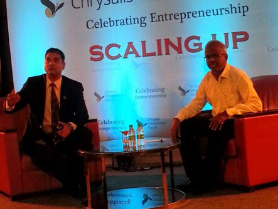 Panel session under ‘Scaling Up’ banner led by a business development consultant and guest entrepreneur.