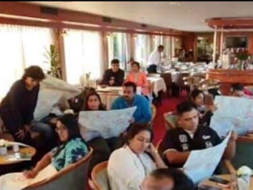 Couples coaching workshop partners reviewing vision maps during an indoor session