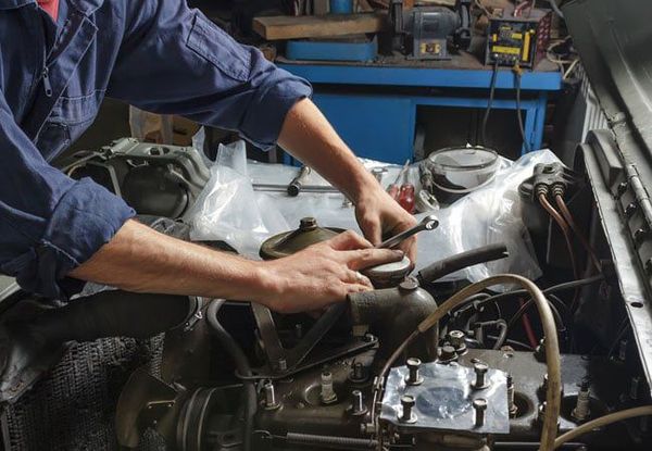 mechanic working on an engine mechanic working on an engine