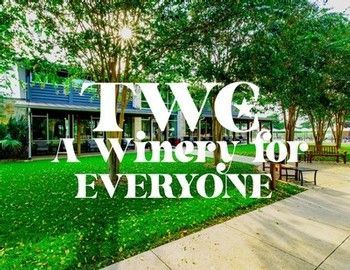 TWC winery sign over a green lawn and sidewalk under trees