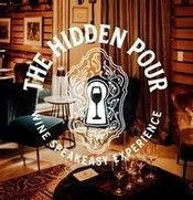 Logo for “The Hidden Pour,” a wine speakeasy, over a warm bar interior with a keyhole and wine glass icon