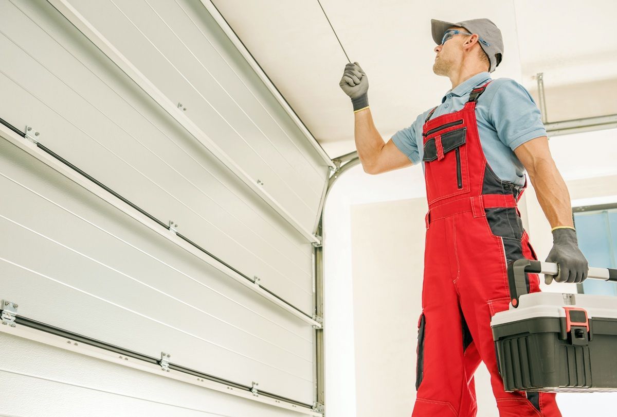 Handyman inspecting household repair needs in Hanford, CA