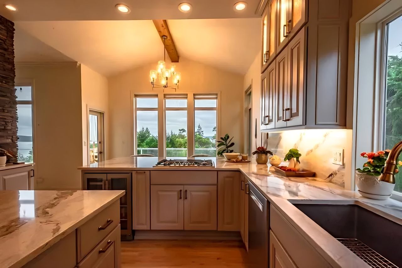 Bright kitchen interior with wooden cabinets, white countertops, and a window over the sink overlooking greenery