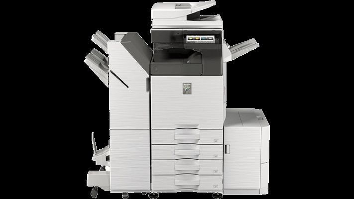 Multi-function office printer with paper trays and document feeder, against black background.