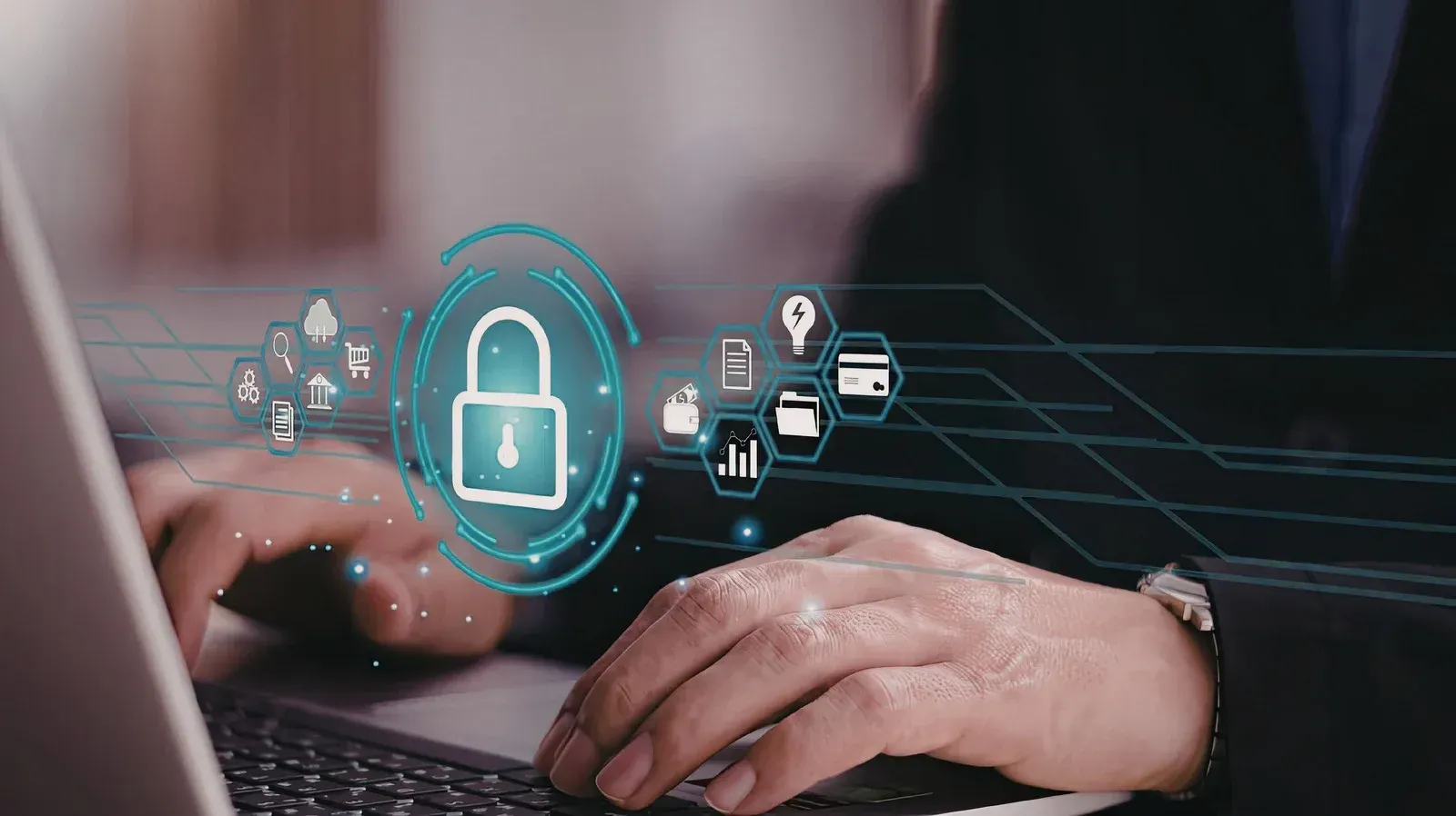 Person using a laptop with digital security icons, including a lock, overlaying the scene.