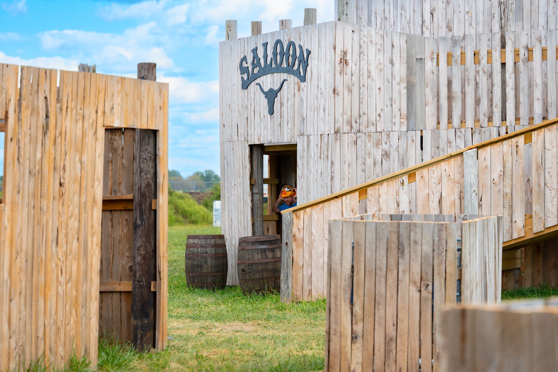 A wooden Wild West-themed paintball course with a 