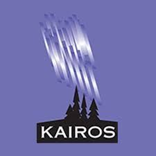 Kairos logo with white streaks above black pine trees on a purple background