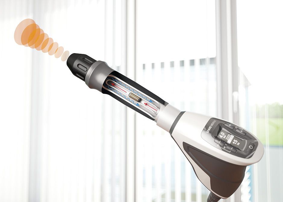 Shockwave therapy applied to the inner elbow to treat golfer's elbow (medial epicondylitis) at a cli