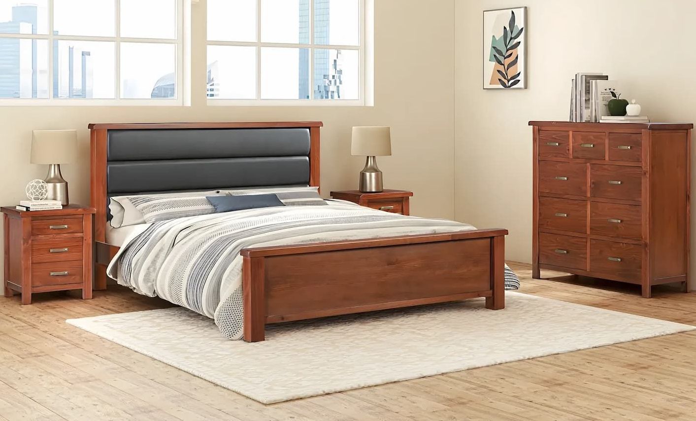 A Bedroom With a Bed, Nightstand, Dresser and Rug — Bryants Beds and Mattresses In Lismore, NSW