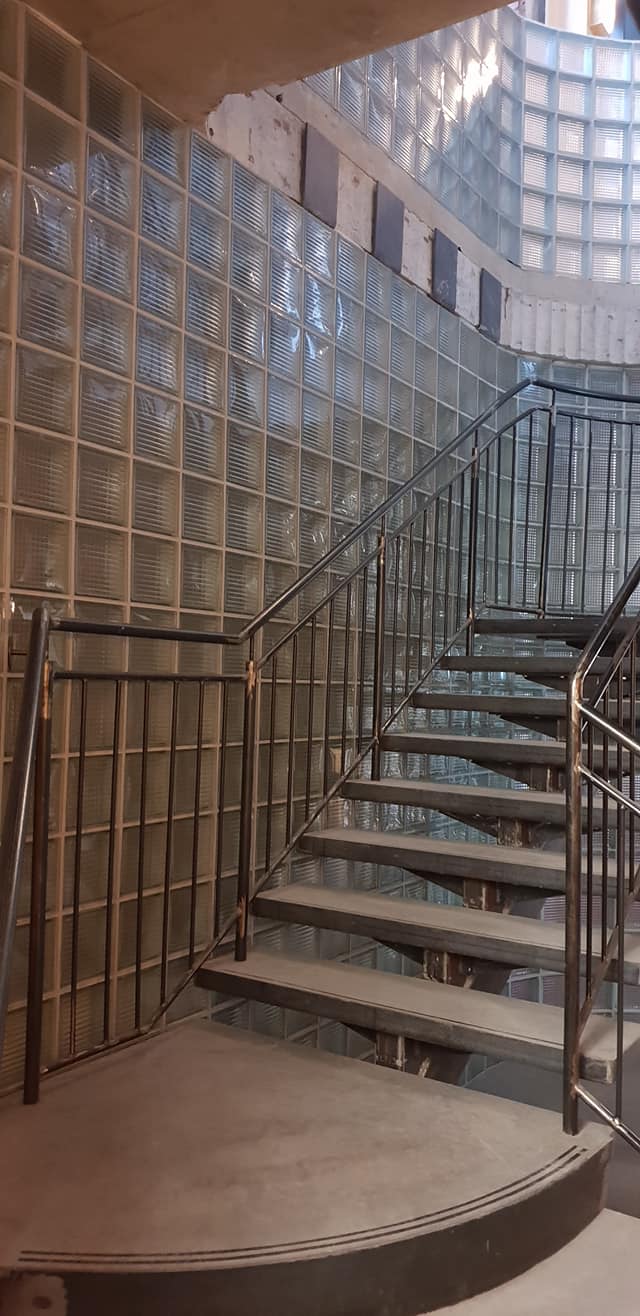 Glass block wall around stairs