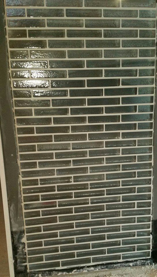 Long, thin glass bricks built into wall