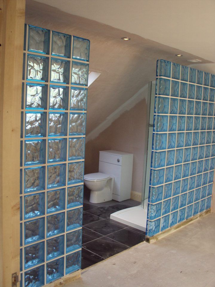 Glass wall to provide light alongside privacy for toilet