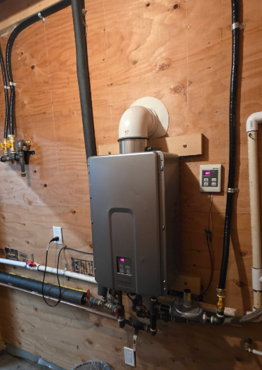 Tankless water heater installed with neat gas piping and venting