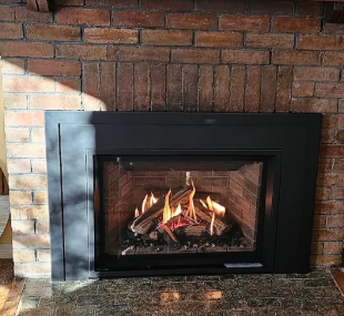 Gas fireplace insert in a brick fireplace