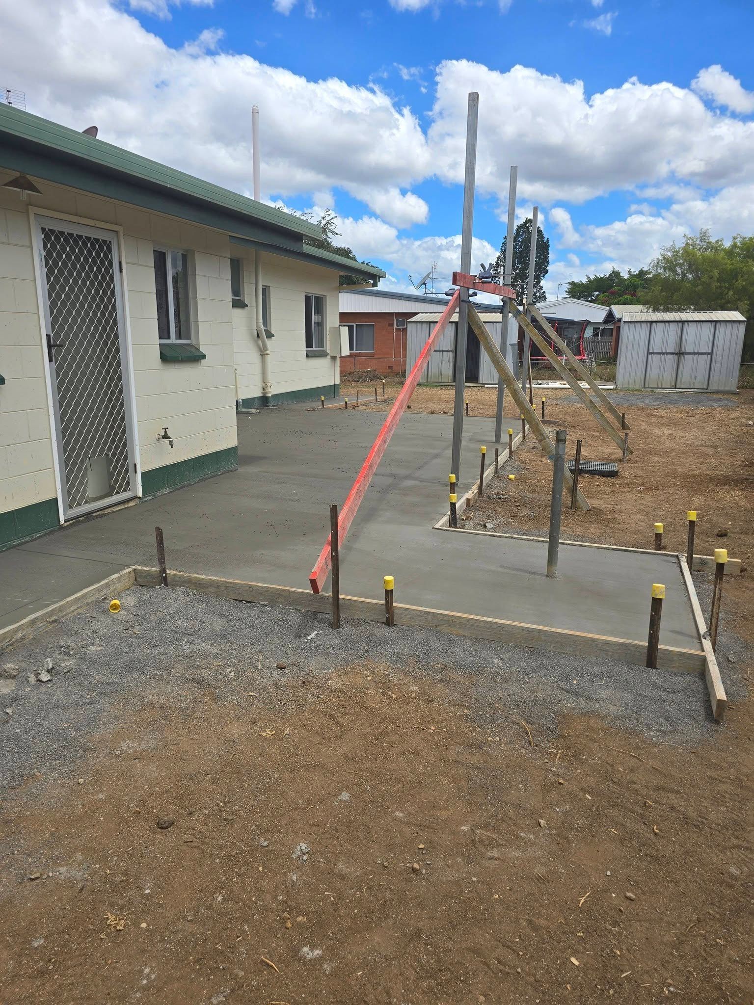 Construction Site Beside a House, with Concrete Forms — Sun Co Concrete And Construction in Dimbulah, QLD