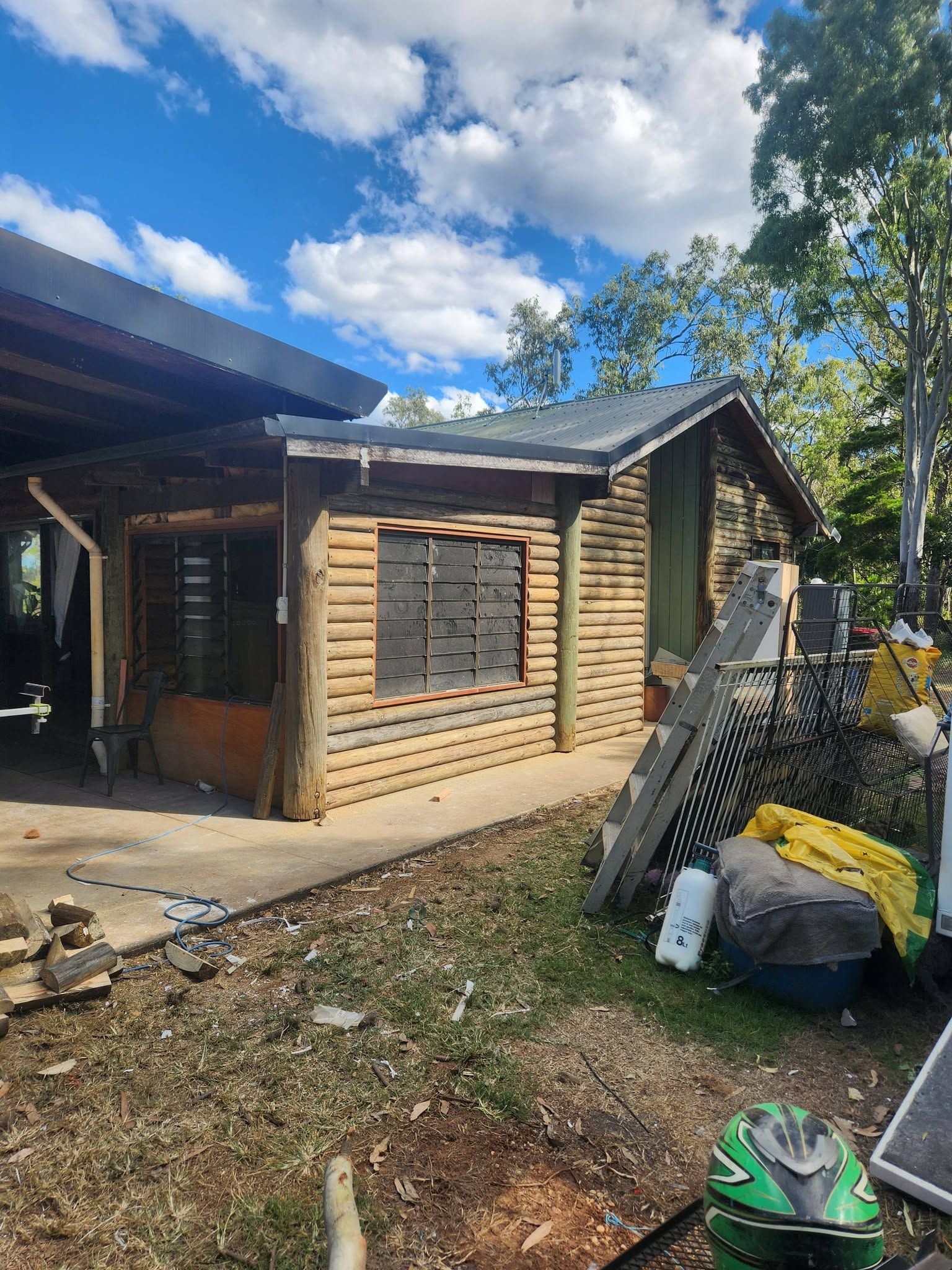 Log Cabin Under Construction with Wood Siding — Sun Co Concrete And Construction in Atherton, QLD