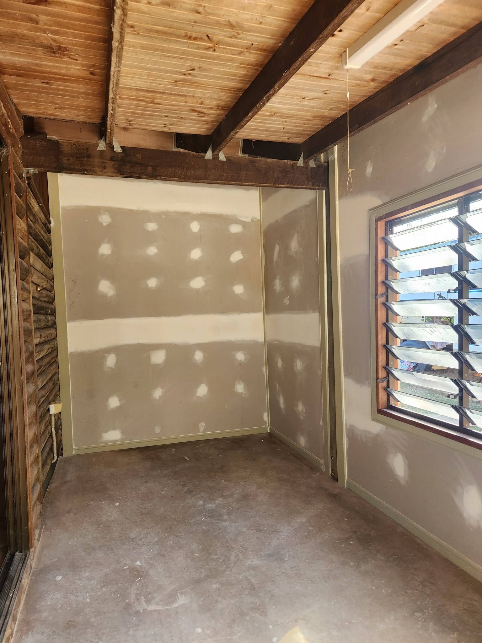 Small Unfinished Room with Patchy Plaster Walls — Sun Co Concrete And Construction in Tablelands, QLD