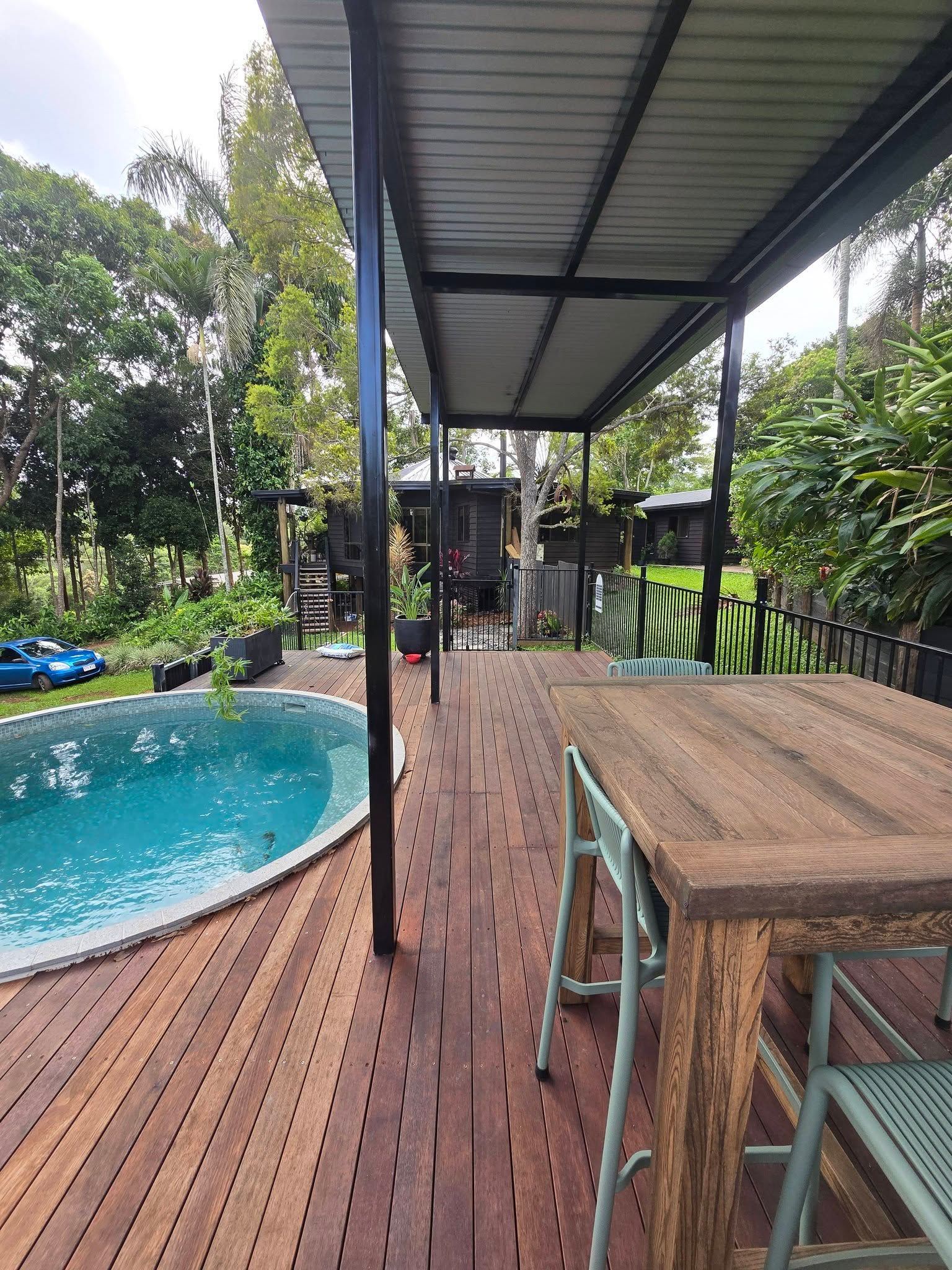 Construction of a Wooden Deck Near a Circular Pool — Sun Co Concrete And Construction in Dimbulah QLD