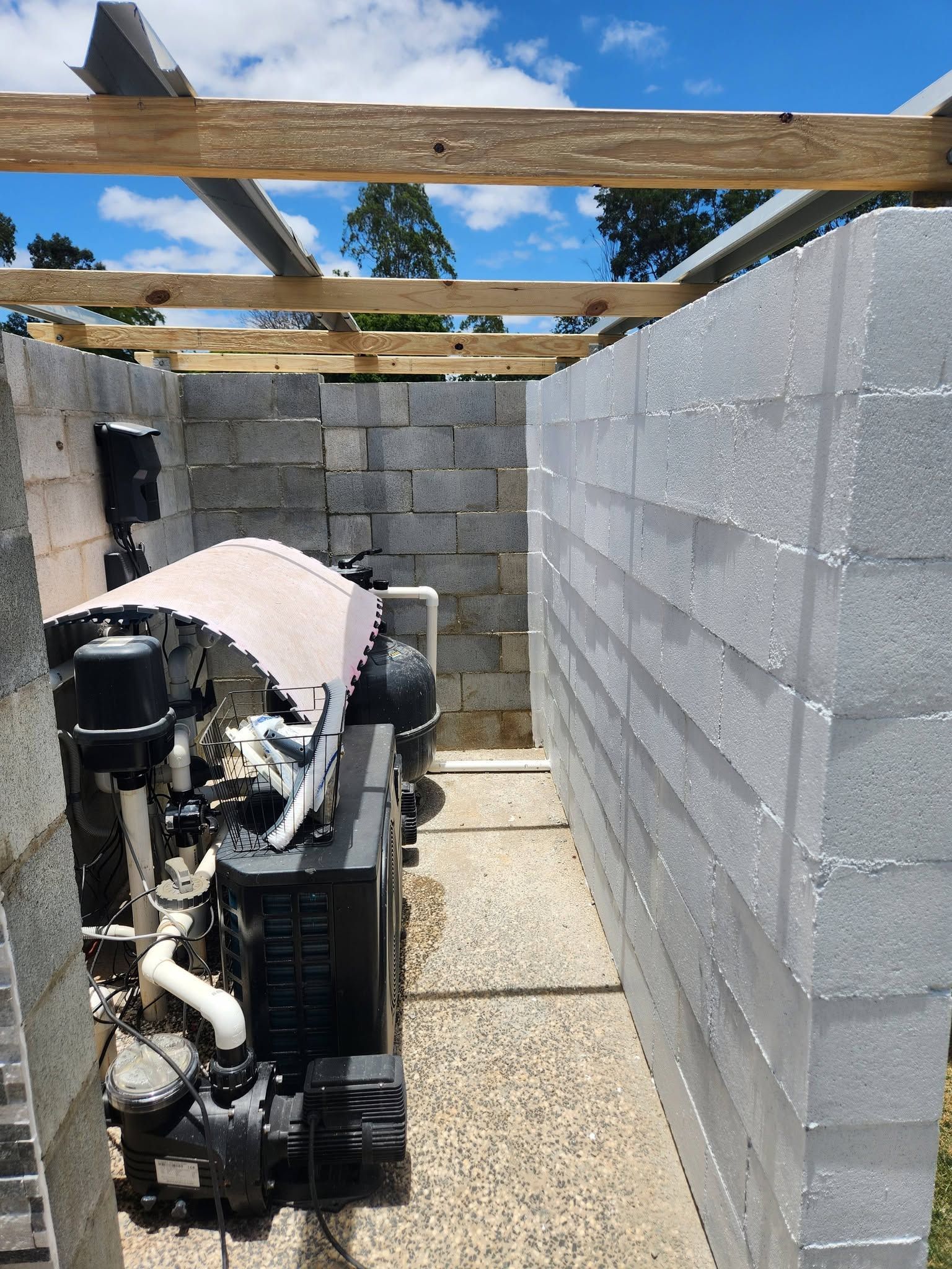 Backyard Construction Site with Cinder Block Walls, Exposed Roof Beams — Sun Co Concrete And Construction in Dimbulah, QLD