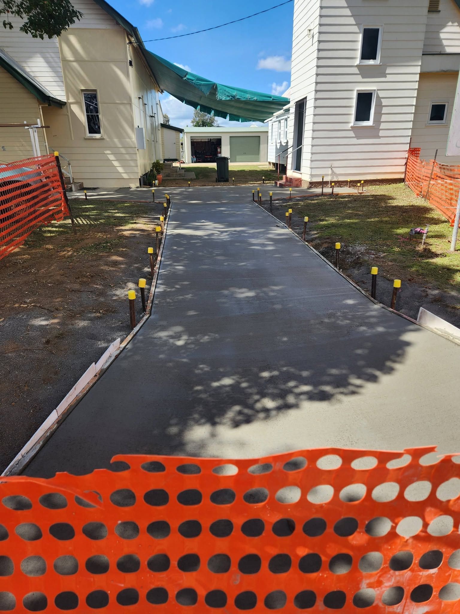 New Paved Walkway Between Two Houses — Sun Co Concrete And Construction in Cairns, QLD