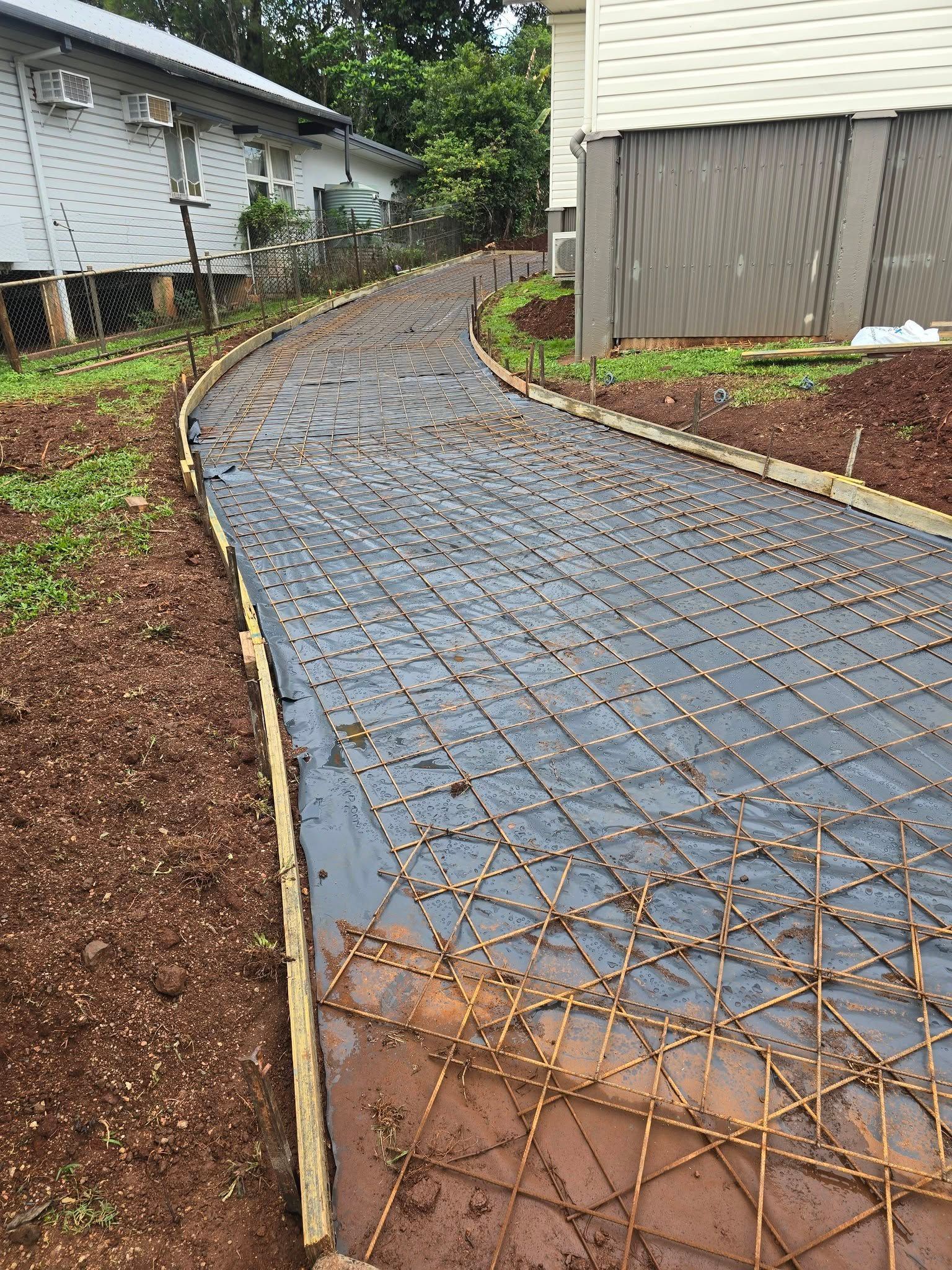 Pathway Construction Rebar Grid Laid Within Wooden Forms — Sun Co Concrete And Construction in Dimbulah, QLD