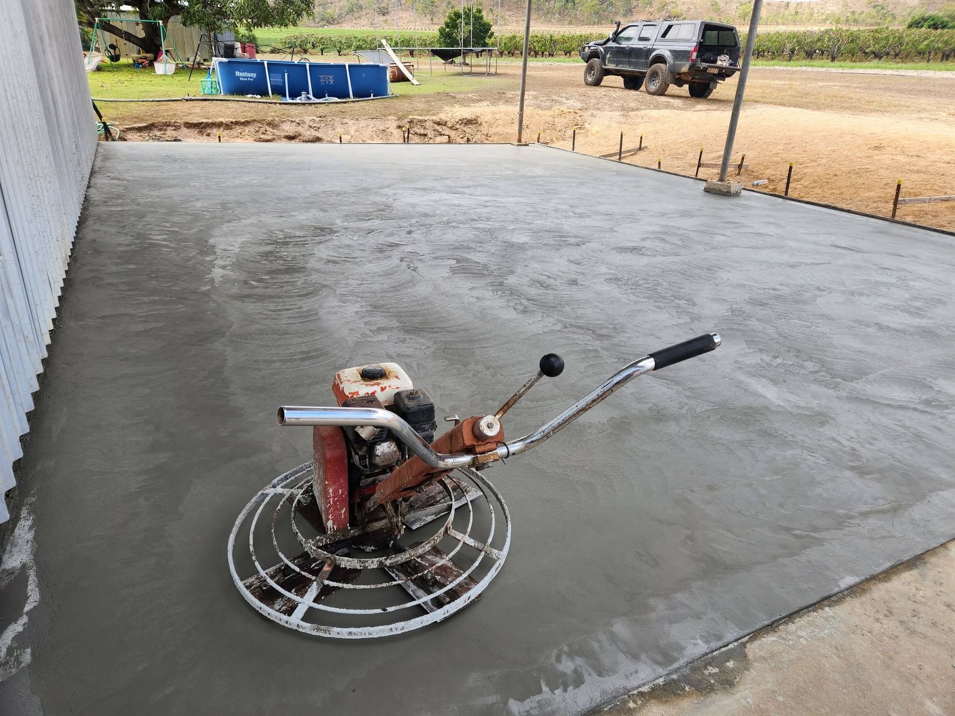 Power Trowel on A Freshly Smoothed Concrete Slab — Sun Co Concrete And Construction in Mareeba, QLD