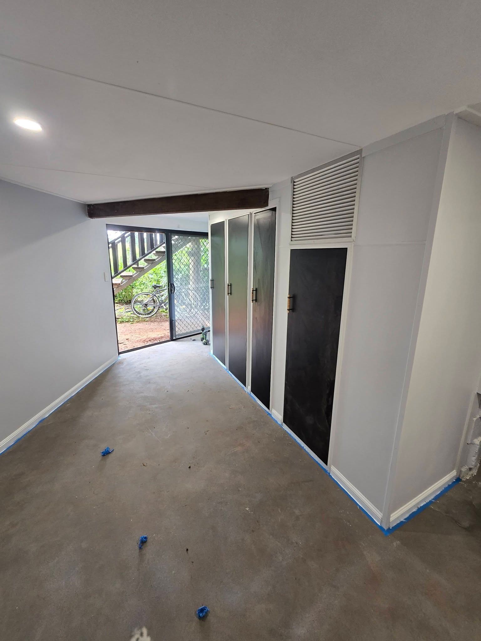 Empty Room with Concrete Floor, White Walls — Sun Co Concrete And Construction in Dimbulah, QLD