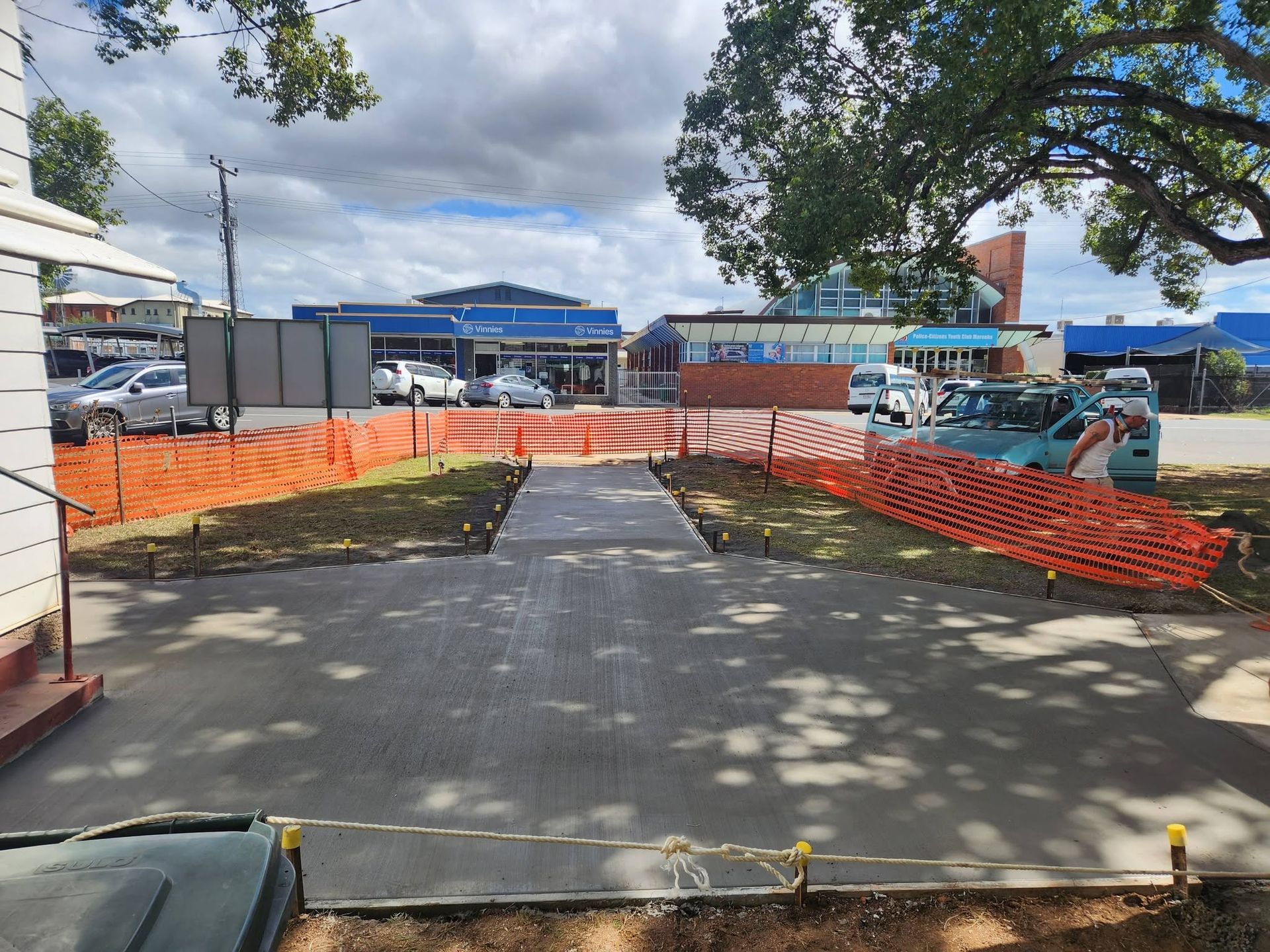 Pathway Into Construction Site with Orange Safety Fencing — Sun Co Concrete And Construction in Dimbulah, QLD
