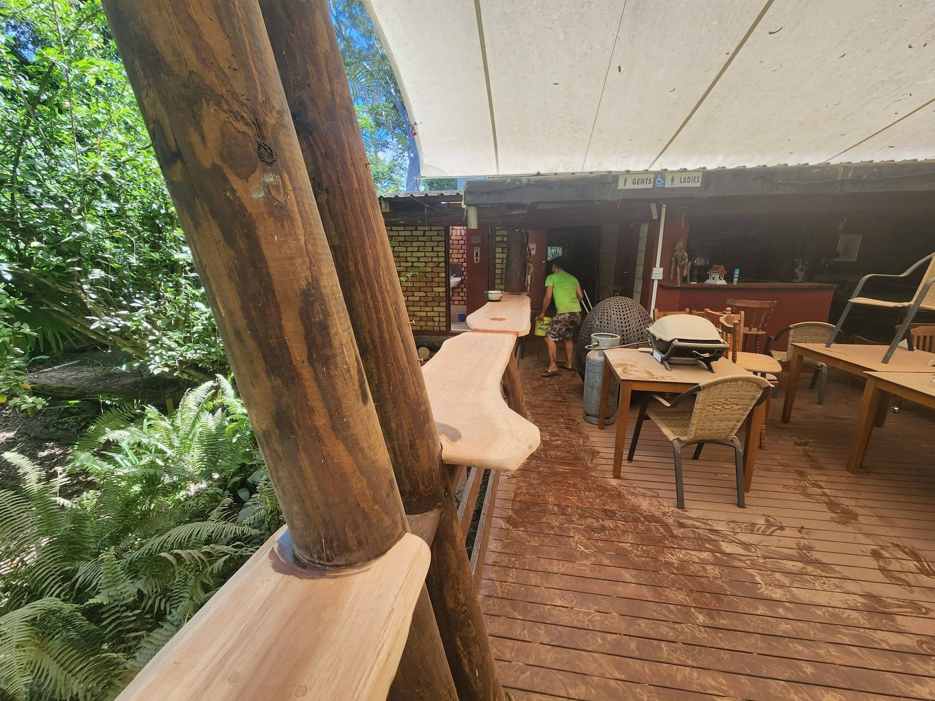 Open-Air Restaurant Deck with Wooden Tables, Curved Bar — Sun Co Concrete And Construction in Dimbulah, QLD