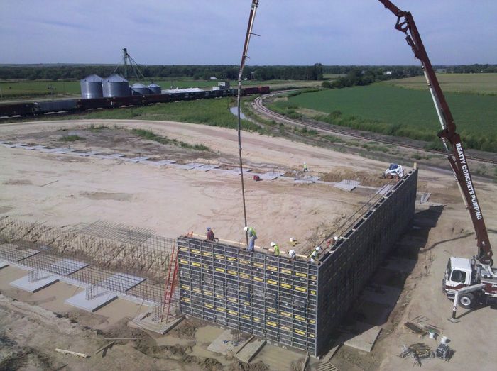 An aerial view of a concrete wall being built