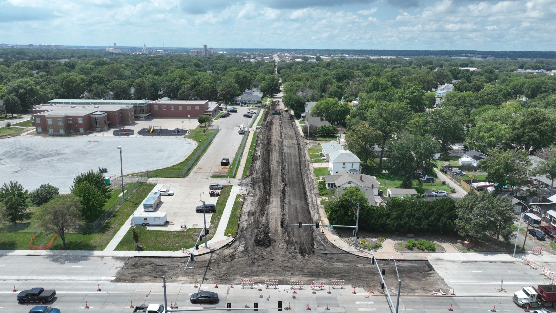 CL Construction paving crew laying fresh concrete on Adams Street in Lincoln, Nebraska, as part of the LTU street rehabilitation project, with a Gomaco Paver machine