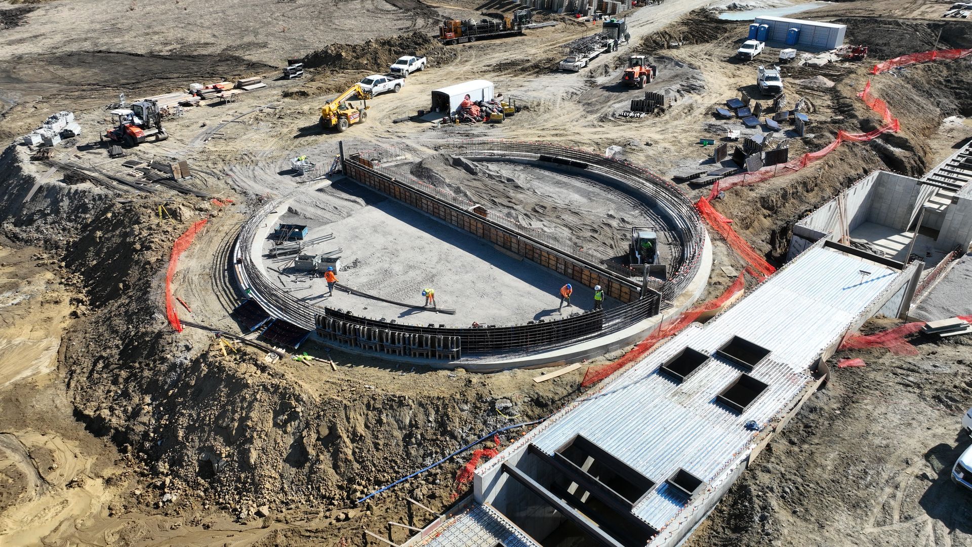 An aerial view of a construction site with a large circle in the middle.