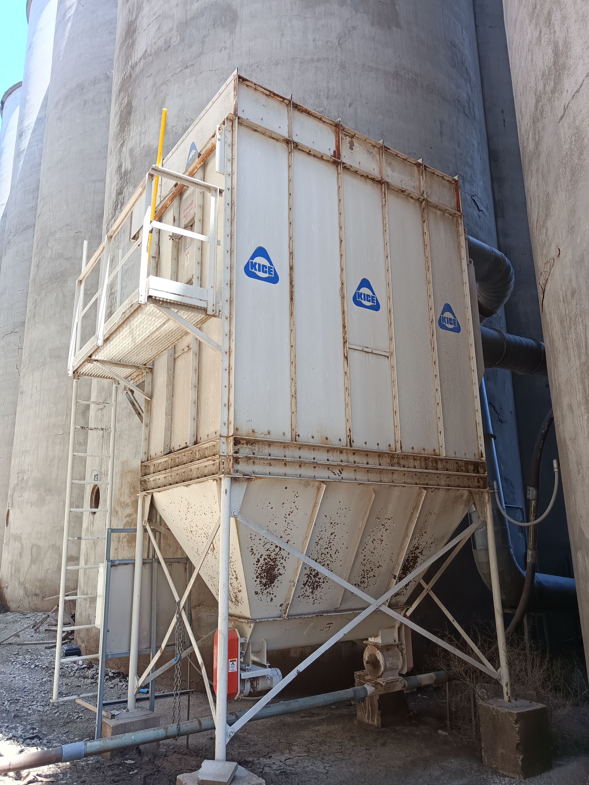 A large white container with a ladder attached to it