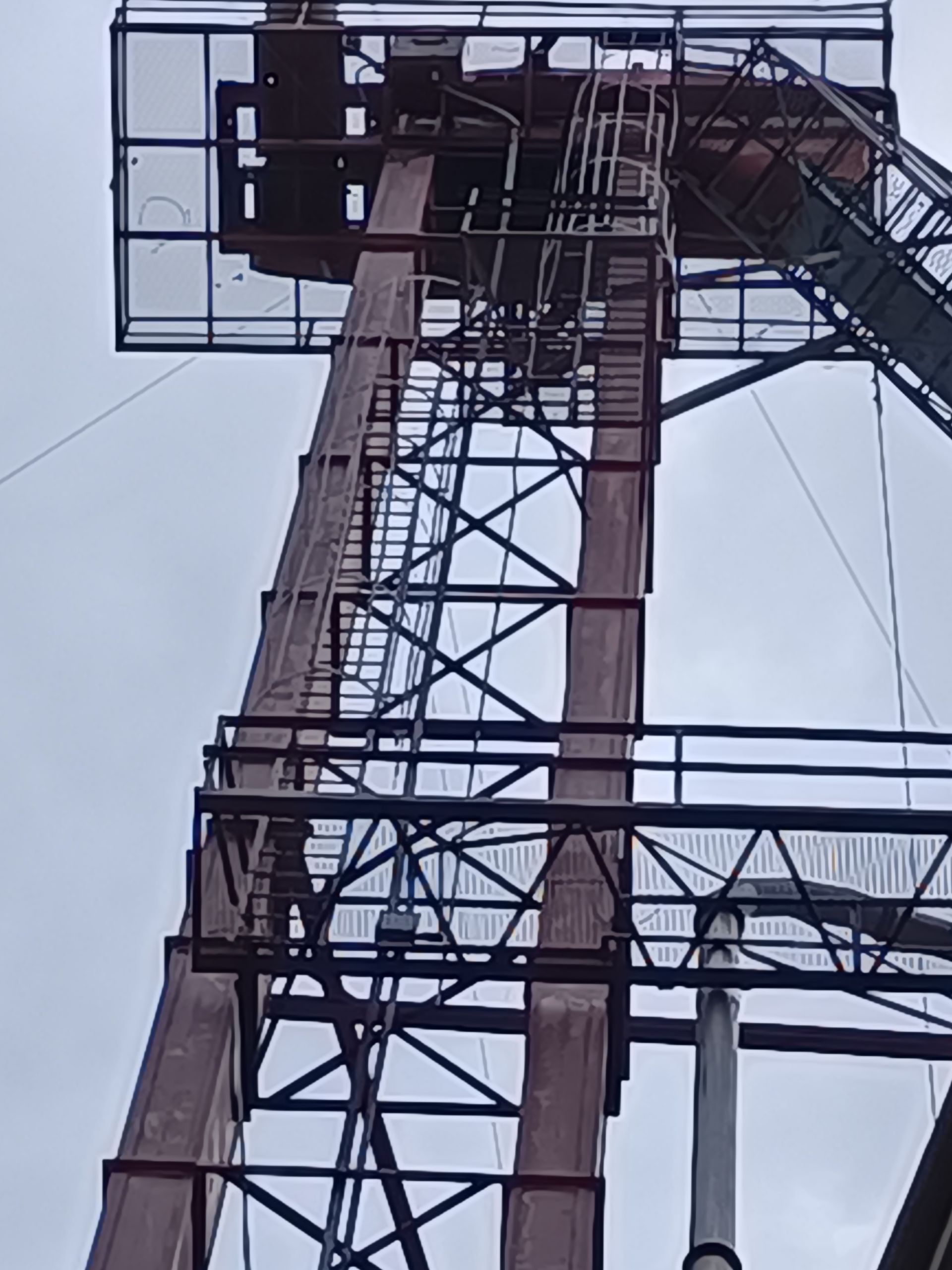 A large metal structure with stairs going up to the top of it