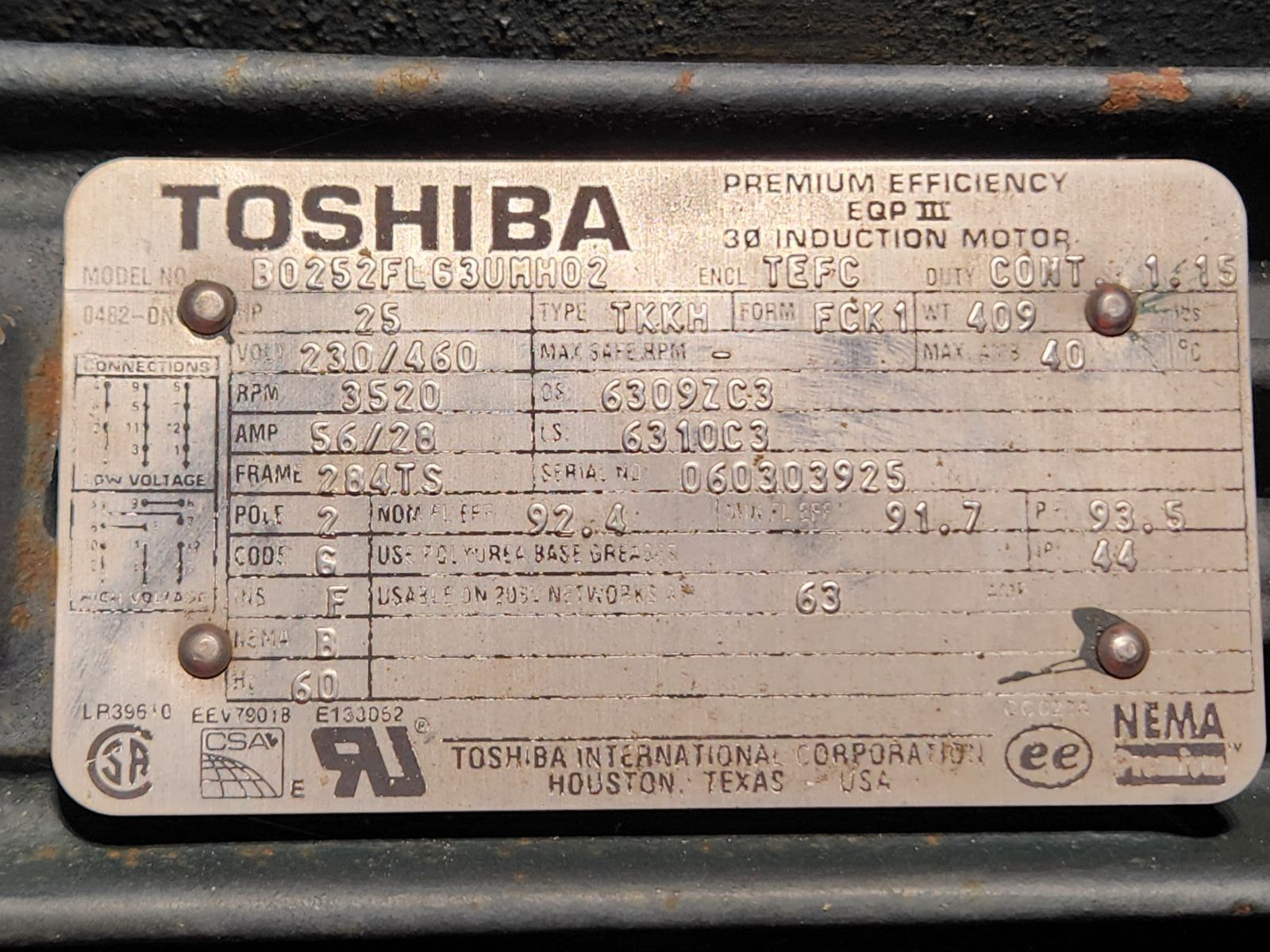 A toshiba motor is sitting on a black surface