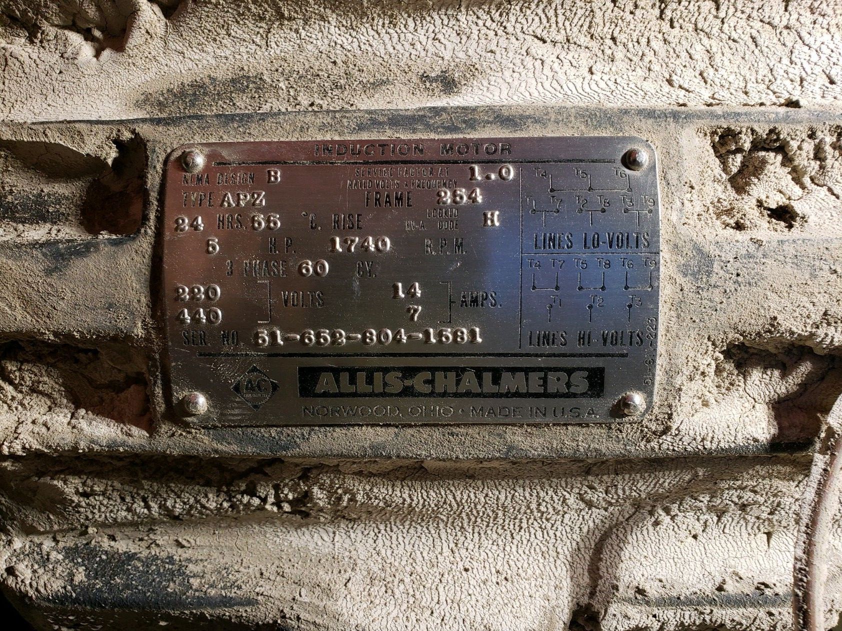 A close up of a metal plate on a machine.