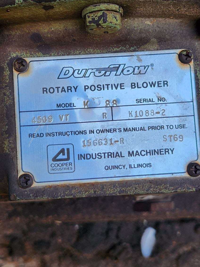 A close up of a label on a rotary positive blower.