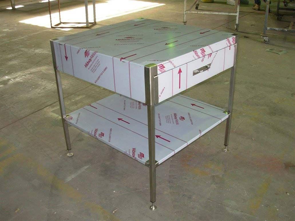 A Stainless Steel Table With Two Shelves and a Box on Top — Sun City Sheetmetal In Cairns, QLD