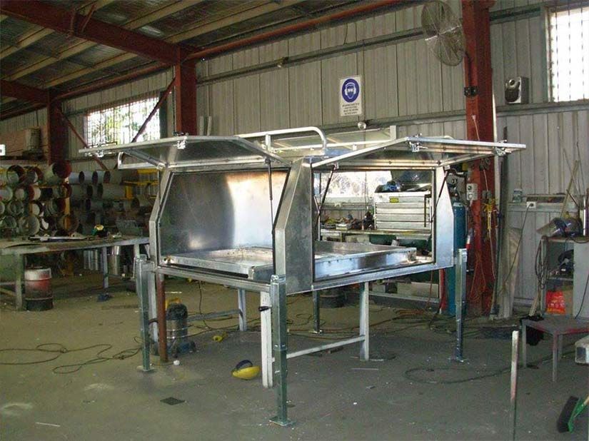 A Stainless Steel Canopy is Being Built in a Garage — Sun City Sheetmetal In Ingham, QLD