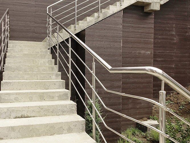 A Set of Stairs With a Stainless Steel Railing — Sun City Sheetmetal In Garbutt, QLD